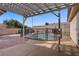 Backyard pool surrounded by patio, fence, and pergola offering shade at 6332 Sierra Pines Ct, Las Vegas, NV 89130
