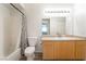 Bathroom featuring a shower-tub combination and a vanity with wooden cabinets at 6955 N Durango Dr # 2099, Las Vegas, NV 89149