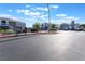Well-kept community entrance with manicured landscaping and ample parking at 6955 N Durango Dr # 2099, Las Vegas, NV 89149