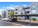 Condominium building featuring a covered parking area with ample parking spaces at 6955 N Durango Dr # 2099, Las Vegas, NV 89149