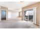 Expansive living room featuring access to a balcony with great view at 6955 N Durango Dr # 2099, Las Vegas, NV 89149