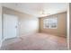 Cozy living room featuring a ceiling fan, large window, and neutral-toned walls at 6955 N Durango Dr # 2099, Las Vegas, NV 89149