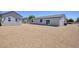 Expansive backyard with low-maintenance landscaping, a home, and an additional building at 790 Lone Pine Rd, Pahrump, NV 89048