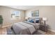 Cozy bedroom with soft lighting, neutral tones, and a view of the outdoors at 790 Lone Pine Rd, Pahrump, NV 89048