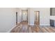 Hallway featuring hardwood floors, white walls and trim, and natural light at 790 Lone Pine Rd, Pahrump, NV 89048