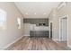 Modern kitchen features gray cabinets, white marble backsplash, stainless appliances and wood look floors at 790 Lone Pine Rd, Pahrump, NV 89048