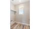 Compact laundry room featuring ample natural light, and convenient shelving at 790 Lone Pine Rd, Pahrump, NV 89048
