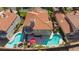 Aerial view of a home with pools, balconies, a patio and lush landscaping at 8244 Horseshoe Bend Ln, Las Vegas, NV 89113