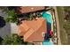 Aerial view of a home with a large tile roof, garden, and pool at 8244 Horseshoe Bend Ln, Las Vegas, NV 89113