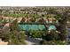 A stunning aerial view of the community's tennis courts and pool, surrounded by lush landscaping and beautiful homes at 8244 Horseshoe Bend Ln, Las Vegas, NV 89113
