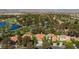 Expansive aerial view of a home with a pool and lush landscaping in a community at 8244 Horseshoe Bend Ln, Las Vegas, NV 89113