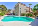 Backyard oasis with a pool, lush greenery, mature trees, and outdoor dining area at 8244 Horseshoe Bend Ln, Las Vegas, NV 89113