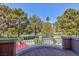 Balcony with a scenic view of lush green trees, offering a serene outdoor living experience at 8244 Horseshoe Bend Ln, Las Vegas, NV 89113