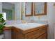 Close-up of a bathroom vanity featuring a sink, countertop, and warm-toned cabinetry at 8244 Horseshoe Bend Ln, Las Vegas, NV 89113