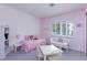 Charming pink bedroom features a cozy bed, white furniture, and a large window filling the room with light at 8244 Horseshoe Bend Ln, Las Vegas, NV 89113