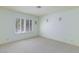 Bright, airy bedroom with soft green walls, shuttered windows, and plush carpeting provides a cozy retreat at 8244 Horseshoe Bend Ln, Las Vegas, NV 89113