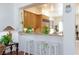 Breakfast bar with granite countertop and seating area that opens to the kitchen at 8244 Horseshoe Bend Ln, Las Vegas, NV 89113