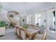 Elegant dining area adjacent to a staircase featuring a grand chandelier and staircase at 8244 Horseshoe Bend Ln, Las Vegas, NV 89113