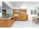 Well-lit kitchen with custom cabinetry, granite countertops, and stainless steel appliances at 8244 Horseshoe Bend Ln, Las Vegas, NV 89113