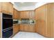 Kitchen featuring stainless steel appliances, built-in oven, and custom cabinetry at 8244 Horseshoe Bend Ln, Las Vegas, NV 89113