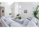 Open living room with ample seating, white walls, lots of natural light and high ceilings at 8244 Horseshoe Bend Ln, Las Vegas, NV 89113