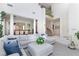 Spacious living area with pillars and a view of the staircase and dining area at 8244 Horseshoe Bend Ln, Las Vegas, NV 89113