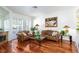 Bright living room with hardwood floors, a fireplace, and ample natural light at 8244 Horseshoe Bend Ln, Las Vegas, NV 89113