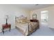 Spacious main bedroom featuring a decorative bed, mirror, and a glimpse of the adjoining bathroom at 8244 Horseshoe Bend Ln, Las Vegas, NV 89113