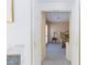 View from hallway leading into bedroom with a comfortable bed, side table and warm interior decor at 8244 Horseshoe Bend Ln, Las Vegas, NV 89113