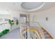 Elegant curved staircase featuring white spindles with wood trim and a recessed ceiling detail above at 8244 Horseshoe Bend Ln, Las Vegas, NV 89113