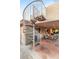 Outdoor patio with a spiral staircase and comfortable seating area at 8275 W Craig Rd, Las Vegas, NV 89129