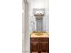 Half bath showcasing granite countertops and updated vanity at 8275 W Craig Rd, Las Vegas, NV 89129