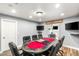 Finished game room with a poker table, comfortable chairs, and modern lighting at 8275 W Craig Rd, Las Vegas, NV 89129