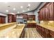 Spacious kitchen with granite counters, modern appliances, and plenty of cabinet storage at 8275 W Craig Rd, Las Vegas, NV 89129