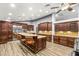 Bright kitchen boasts stone counters, stainless steel appliances, breakfast bar, and custom cabinetry at 8275 W Craig Rd, Las Vegas, NV 89129