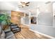 Living room features hard surface flooring, high ceilings, and a decorative plant at 8275 W Craig Rd, Las Vegas, NV 89129