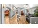 Open-concept floorplan showing living room, dining room, and archways into other rooms at 8275 W Craig Rd, Las Vegas, NV 89129