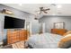 Open main bedroom with wood floors, a ceiling fan, and dual dressers at 8275 W Craig Rd, Las Vegas, NV 89129