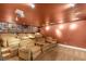 Home theater boasts plush seating, tiered platforms, and custom shelving for media storage at 8275 W Craig Rd, Las Vegas, NV 89129