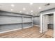 Large walk-in closet featuring wood floors and multiple shelves at 8275 W Craig Rd, Las Vegas, NV 89129