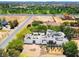 Expansive aerial view of modern home with desert landscaping, solar panels, and picturesque community surroundings at 8525 W Verde Way, Las Vegas, NV 89149