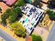 Modern home seen from above with a pool, a manicured yard, several patio spaces and a solar panel array at 8525 W Verde Way, Las Vegas, NV 89149