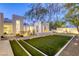 Stunning backyard with artificial lawn and a tranquil meditation space at 8525 W Verde Way, Las Vegas, NV 89149