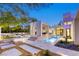 Striking backyard features a pool, dining area, and impeccable landscaping, offering a serene outdoor living space at 8525 W Verde Way, Las Vegas, NV 89149