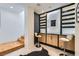 Stylish bar area with illuminated shelving, seating, and convenient stair access at 8525 W Verde Way, Las Vegas, NV 89149