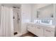 Bright bathroom featuring a glass-enclosed shower and floating vanity with storage at 8525 W Verde Way, Las Vegas, NV 89149