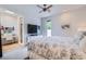 Bedroom featuring a large window, TV console and an attached office space at 8525 W Verde Way, Las Vegas, NV 89149
