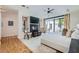 Spacious bedroom featuring hardwood floors, designer headboard, ceiling fan and fireplace and a backyard view at 8525 W Verde Way, Las Vegas, NV 89149