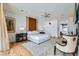 Spacious bedroom featuring hardwood floors, designer headboard, ceiling fan and fireplace at 8525 W Verde Way, Las Vegas, NV 89149