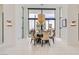 Elegant dining room with modern decor and a view of the outdoor area at 8525 W Verde Way, Las Vegas, NV 89149